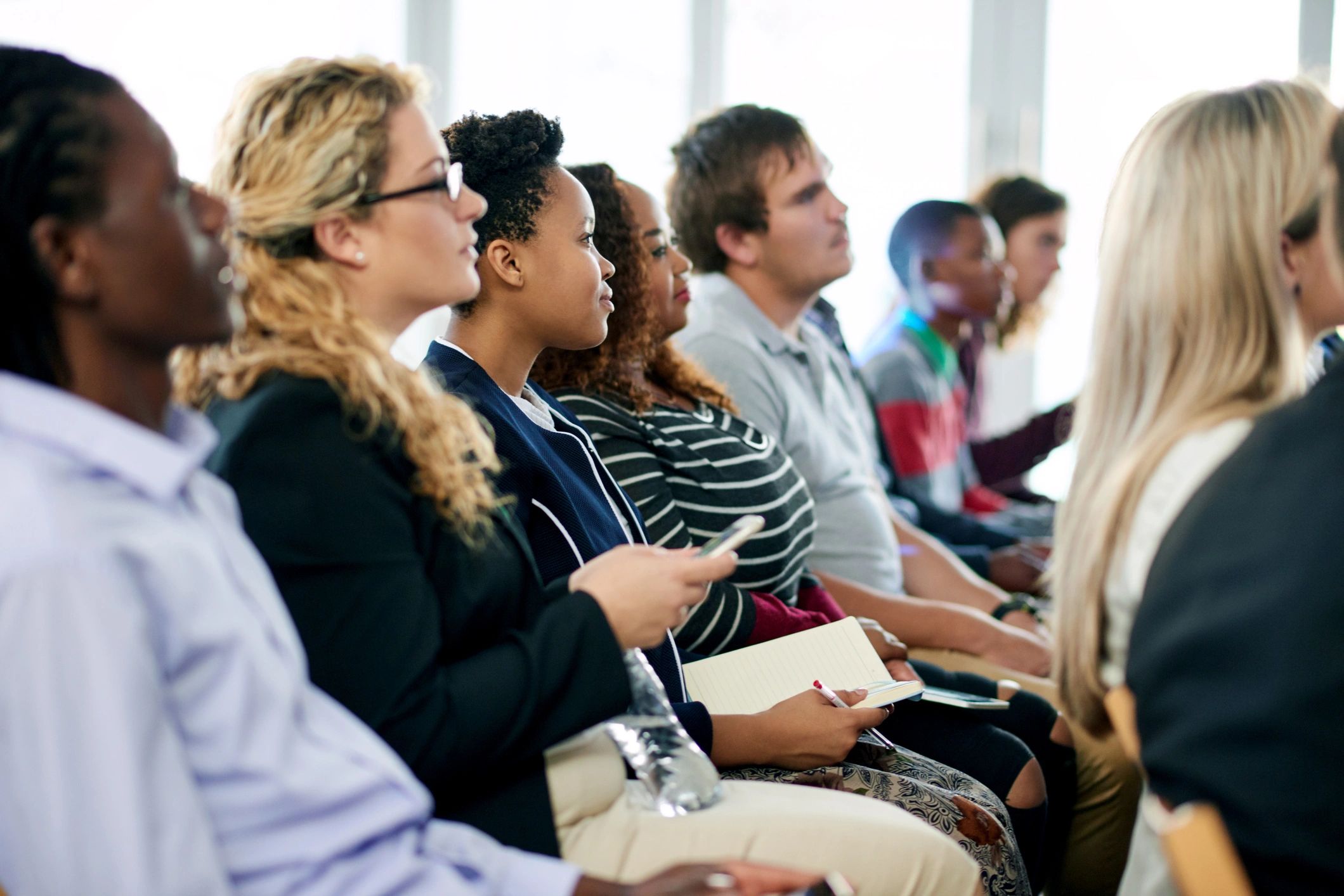 Audience seated during a conference presentation