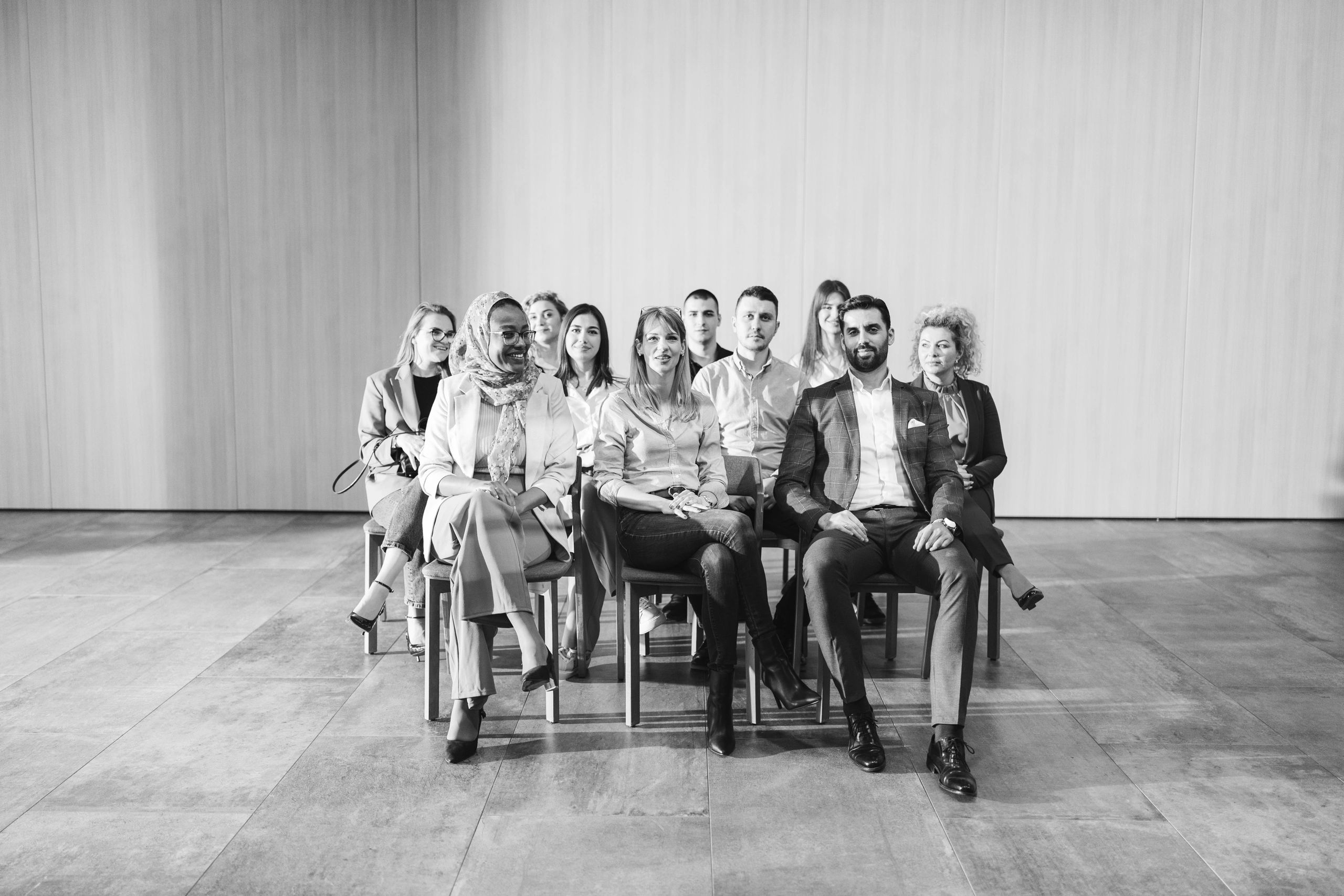 Conference attendees seated in a formal session