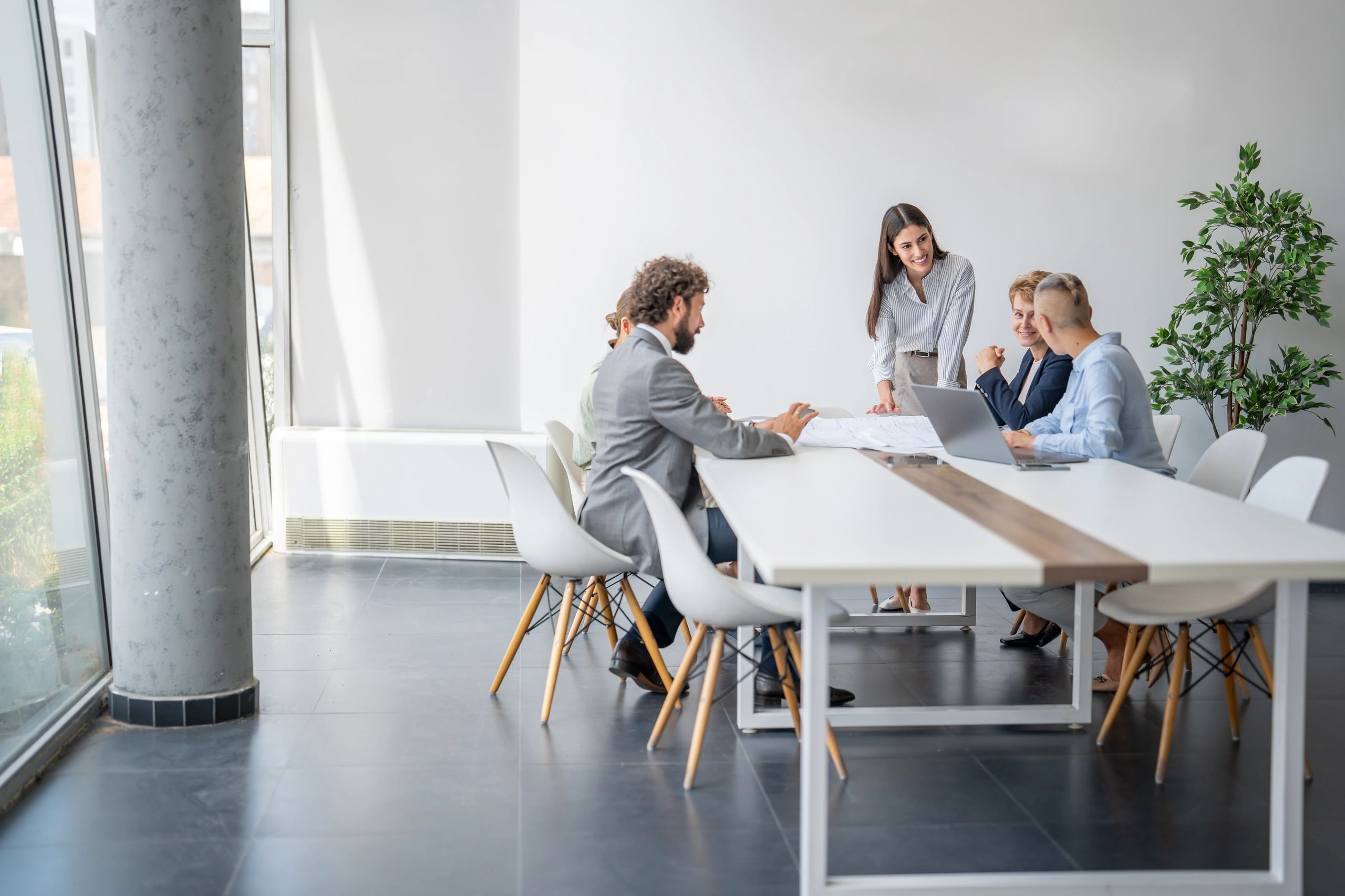 Committee members collaborating around a conference table