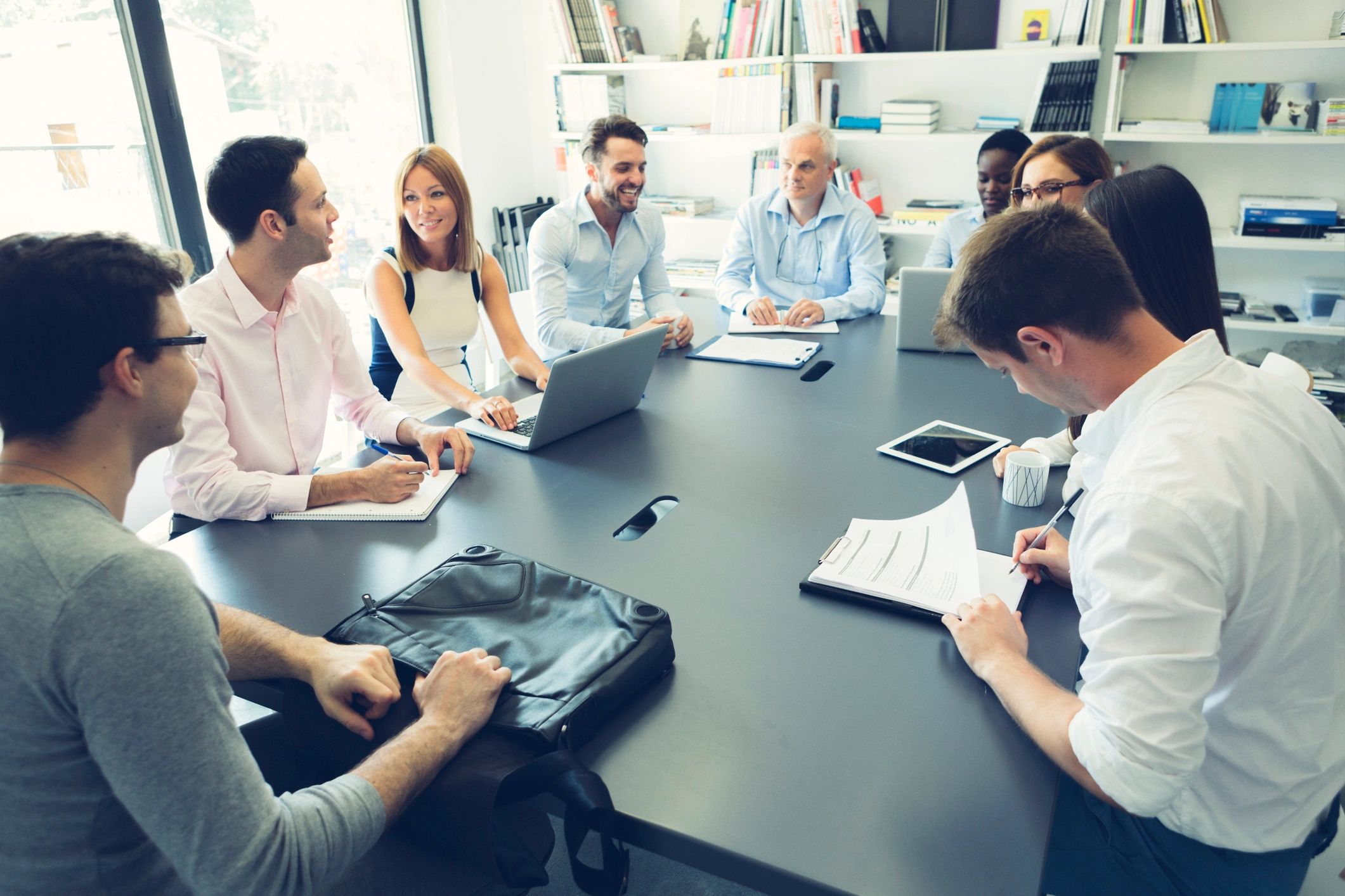 Group meeting in a formal boardroom setting